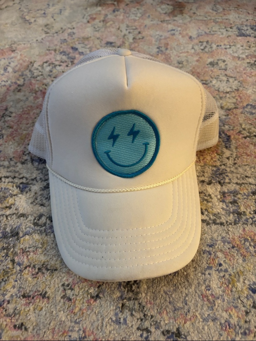 Women’s White Trucker Hat with Blue Smiley Patch